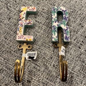 Anthropologie brand new beautiful floral ceramic wall hooks in ‘E.’ R has sold.